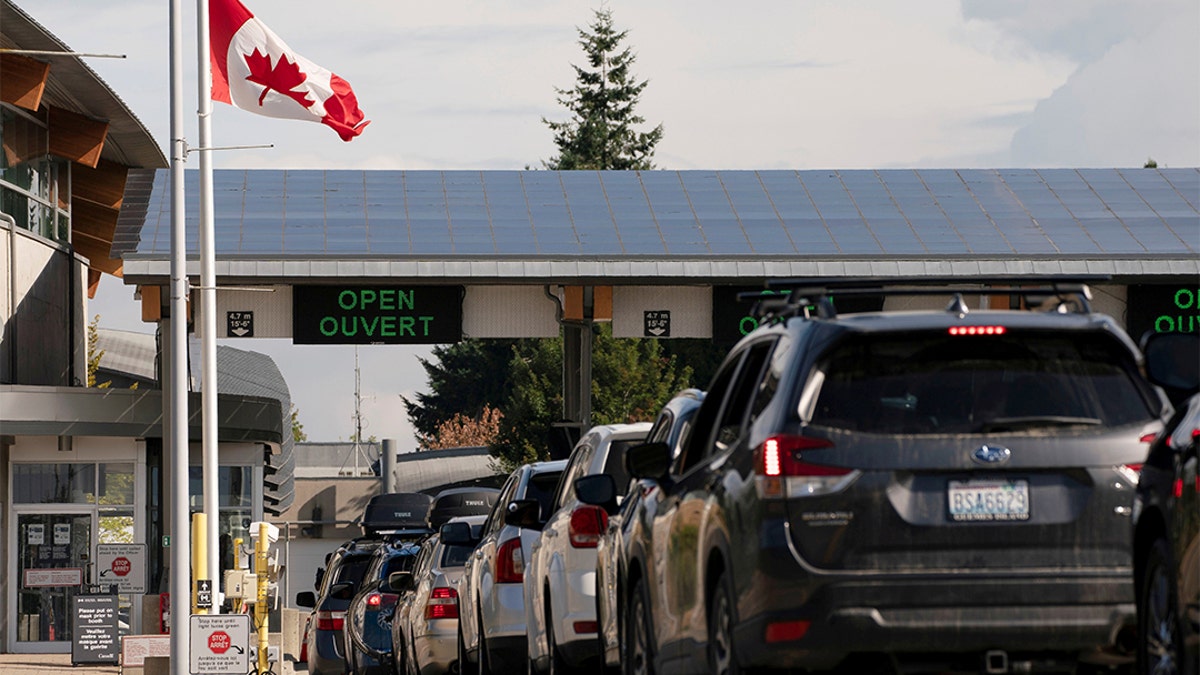 People cross the U.S.-Canadian border in Blaine, Wash., Aug. 9, 2021.