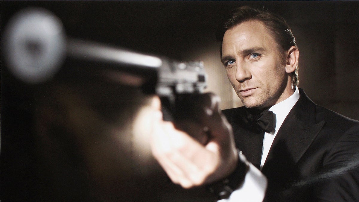 Daniel Craig holds a weapon in Casino Royale promo